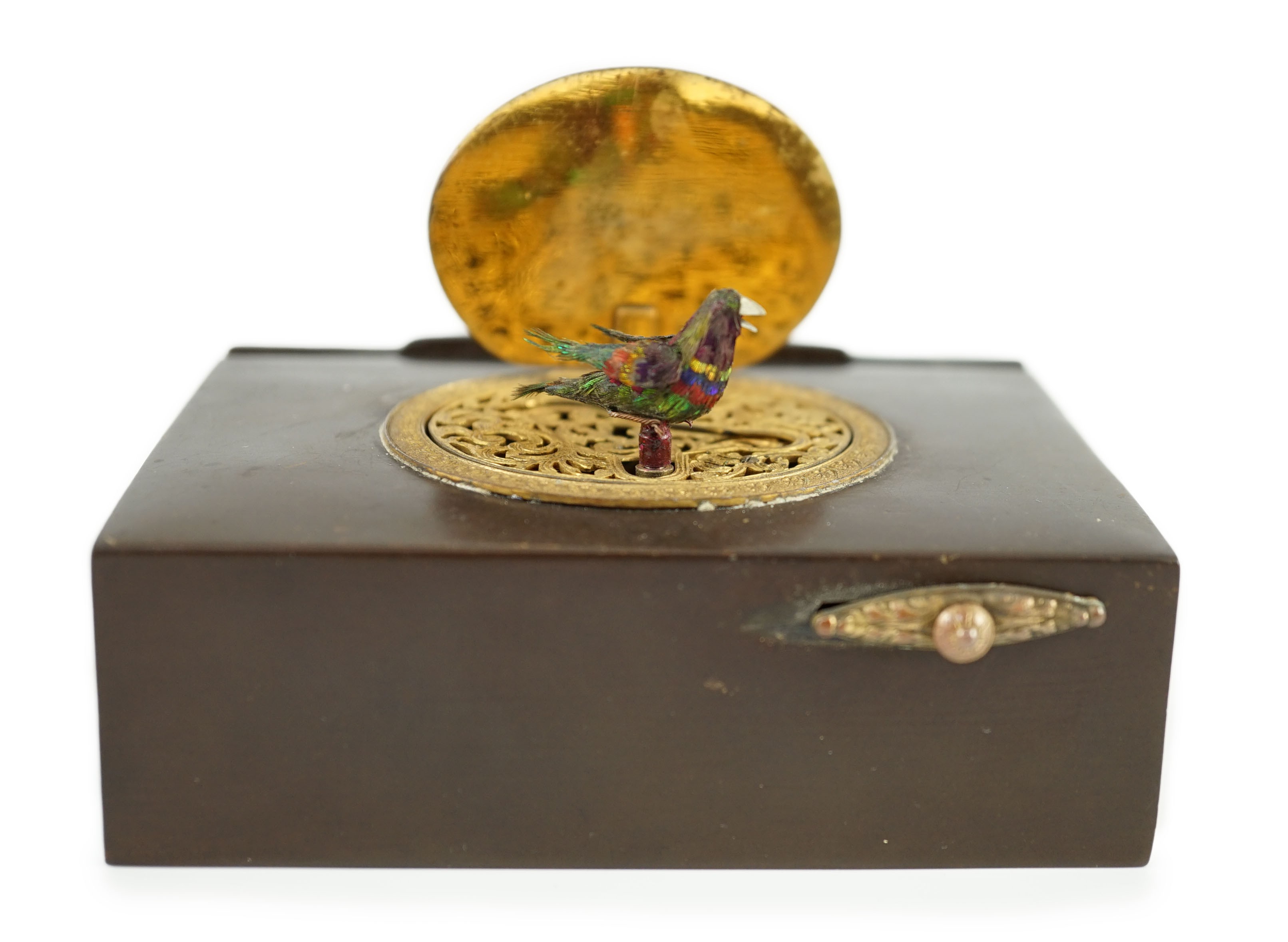 A late 19th century Swiss gilt metal mounted phenolic singing bird box, 10 x 7cm, 3cm high
